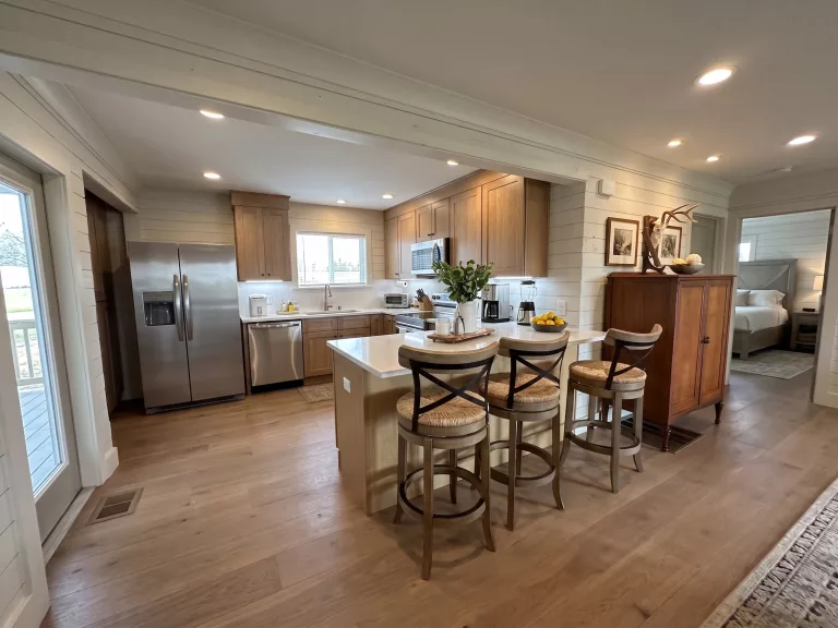 Bright open-concept kitchen and island seating in our DeLeon Springs short-term rental, a premier Airbnb near Whitewood Ranch.